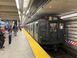 A midday holiday train is awaiting its departure from 96th St Station 